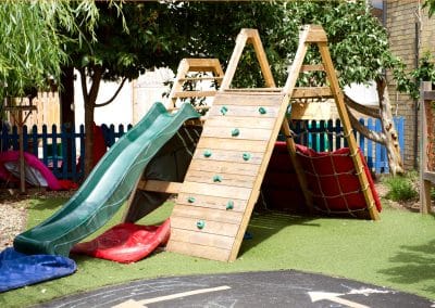 Climbing playground and slide in the garden of Cambridge nursery