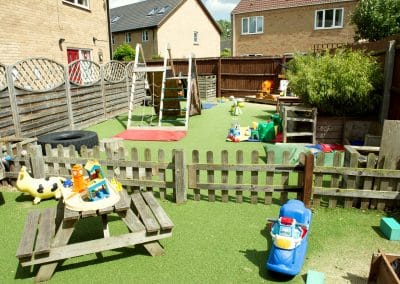 Clarence House Chatteris Nursery garden with a lot of different outside toys