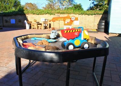 Tray with outside toys in the garden of Godmanchester preschool
